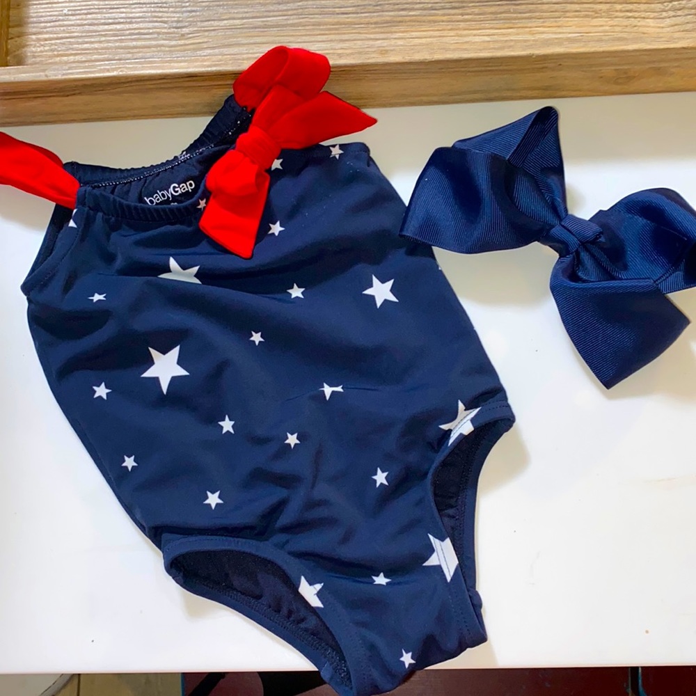 Gently used Baby Gap 0-6 months Navy with white stars and red straps and bow